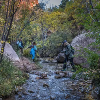 a person standing next to a waterfall