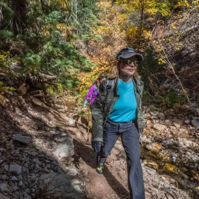 a man standing on a rocky hill