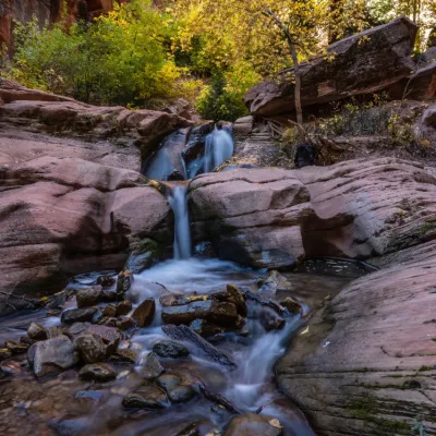 a large waterfall over a rocky area
