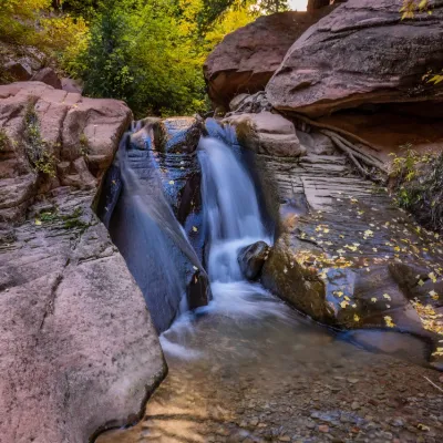 a large waterfall over a rocky area