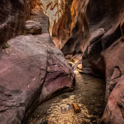a person sitting on a rock